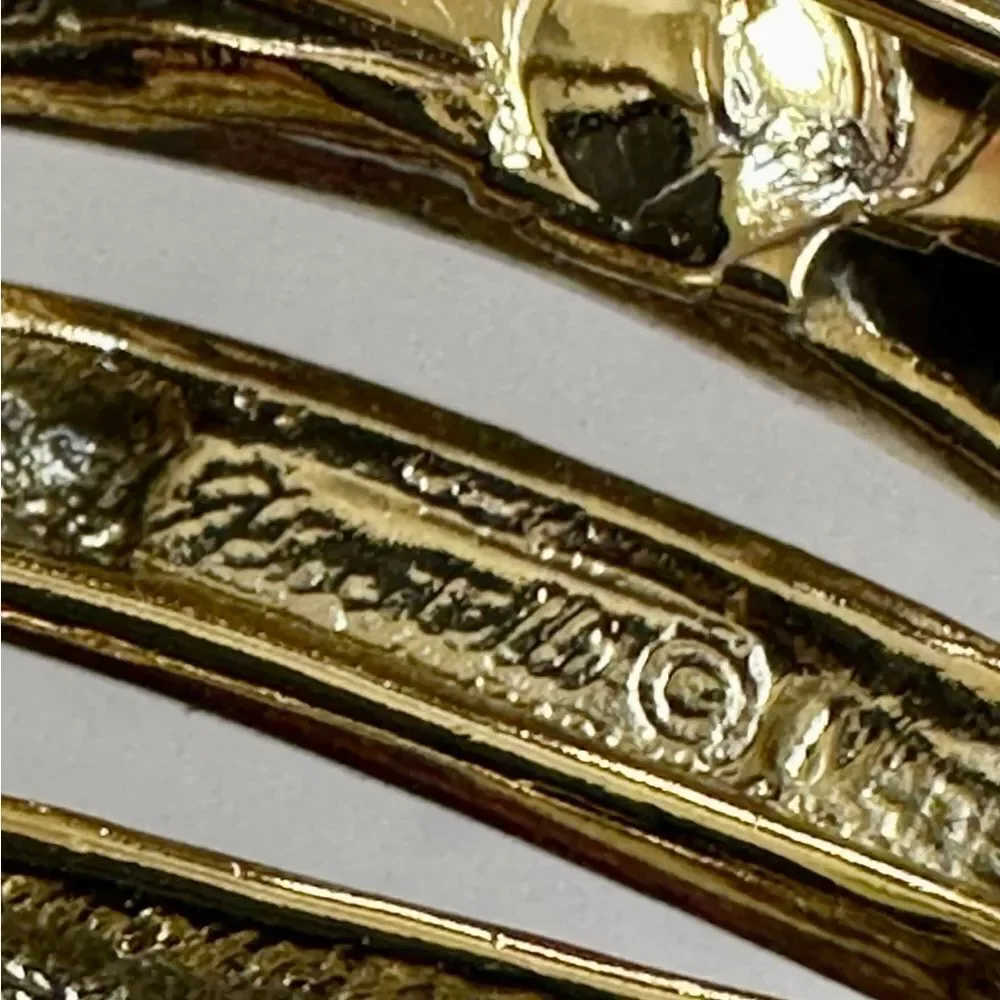 Gold tone brooch
